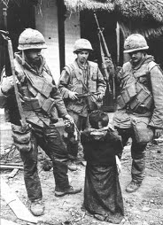 US Soldiers standing around Vietnamese civilian taunting him before shooting him